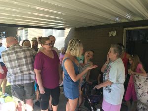 Grandmother surrounded by family