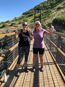 Two women on a suspension bridge