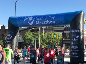 Crossing the Utah Valley 10k finish line