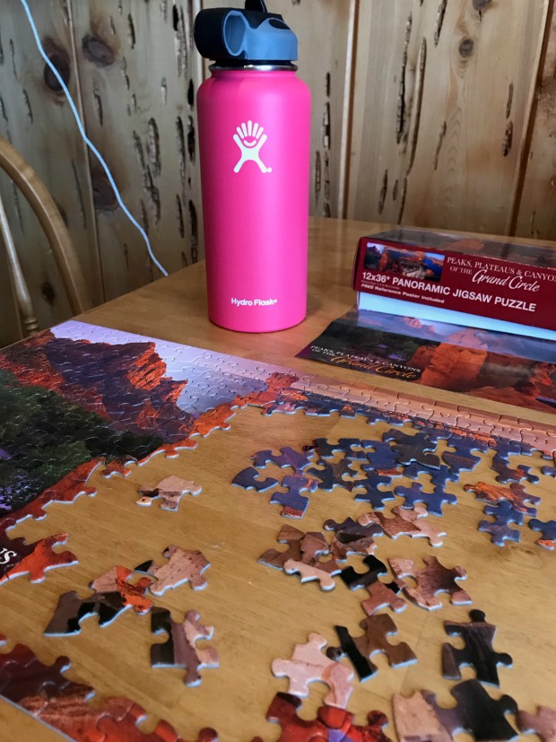 Jigsaw puzzle and water bottle.