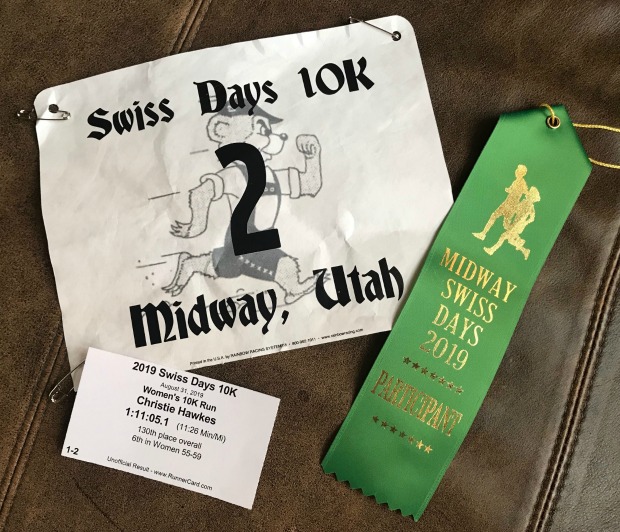 Swiss Days 10K race bib, finisher's ribbon, and race results.