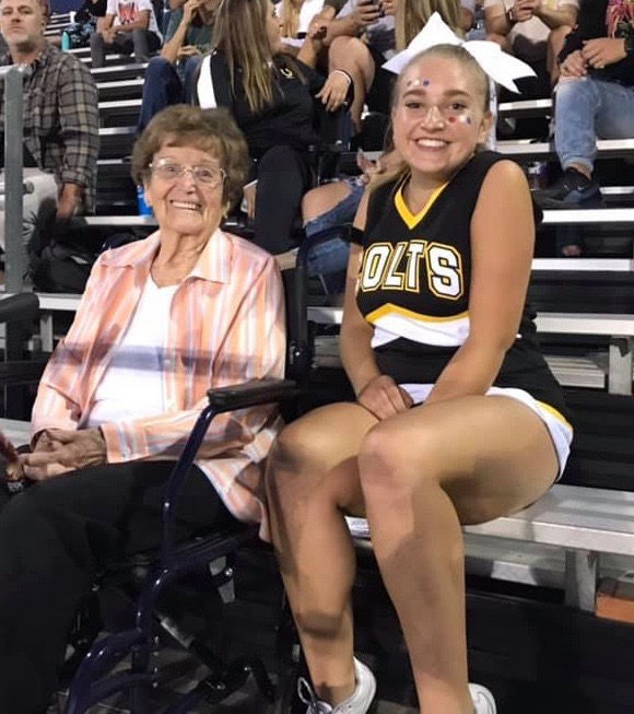 Grandmother and granddaughter at a football game.