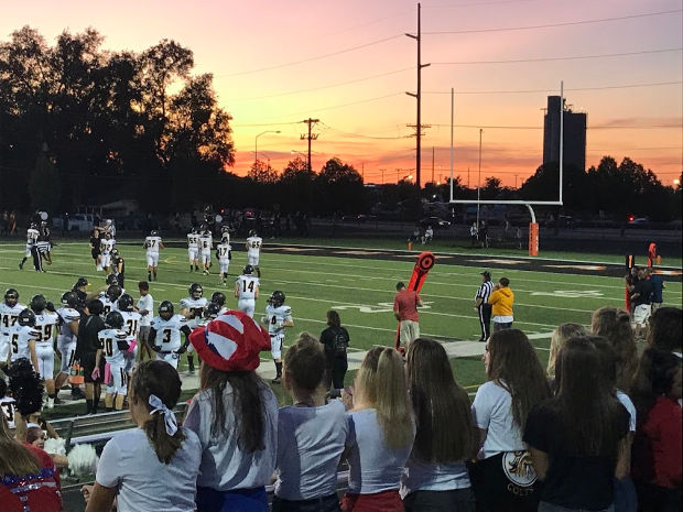 Sunset at high school football game.