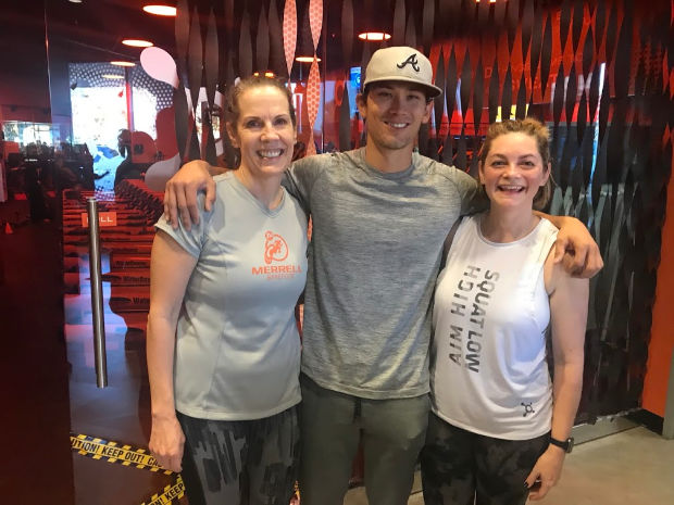 Two ladies and a man at Orangetheory Fitness.