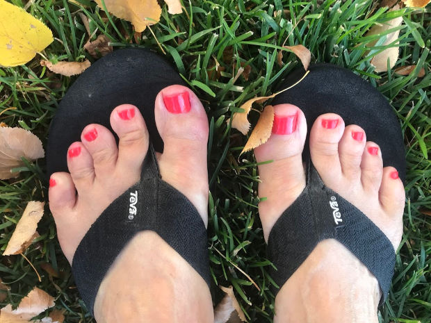 Feet in fall leaves.