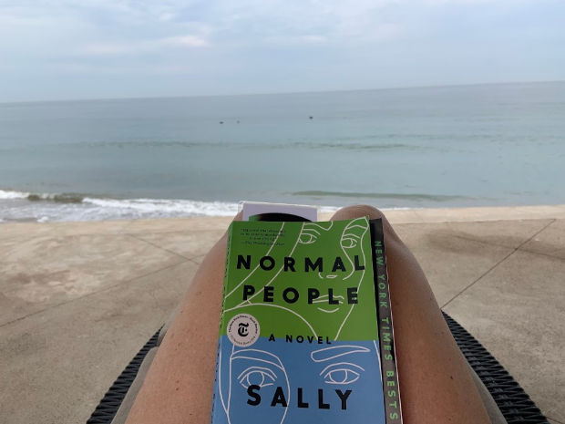 Reading Normal People by the ocean.