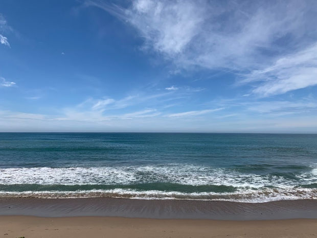 Blue sky and clouds over the ocean in Mazatlan, Mexico.