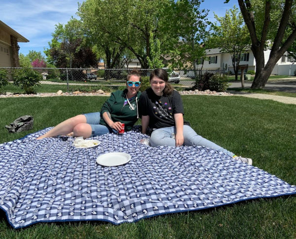 Mother and daughter at a picnic.