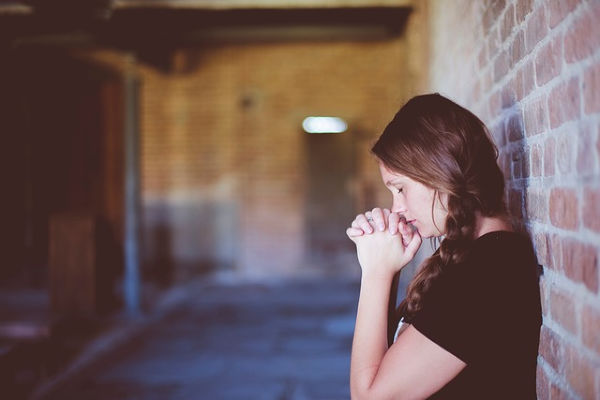 Woman praying.