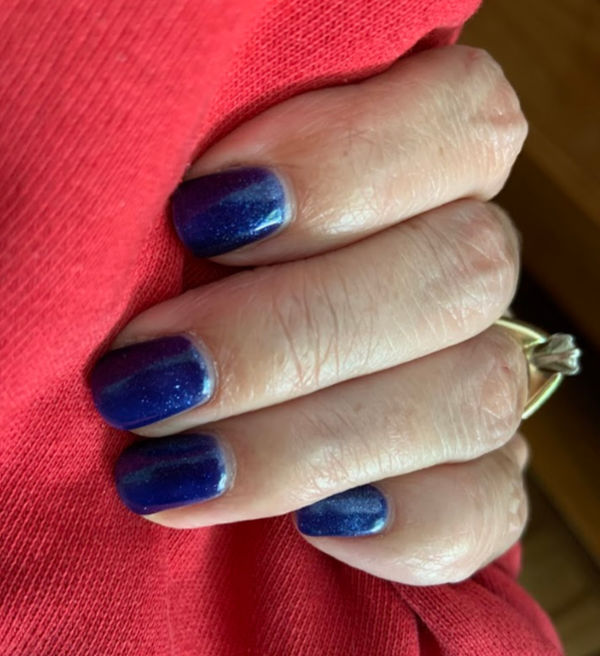 Navy blue nail polish.