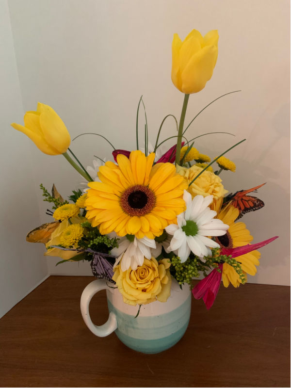 Flower arrangement with butterflies.