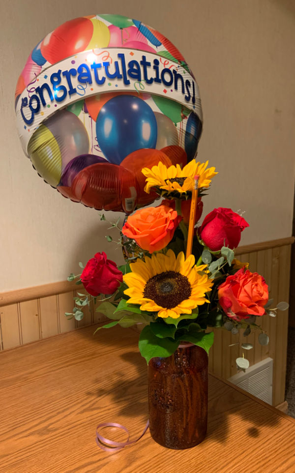 Flowers with Congratulations balloon.