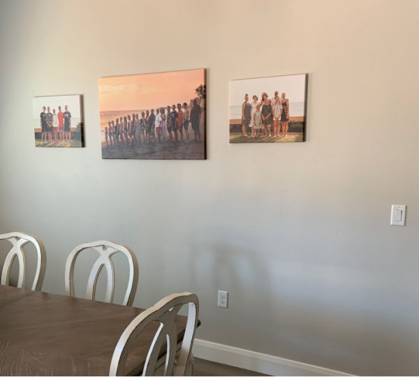 Family photos over the dining room table.