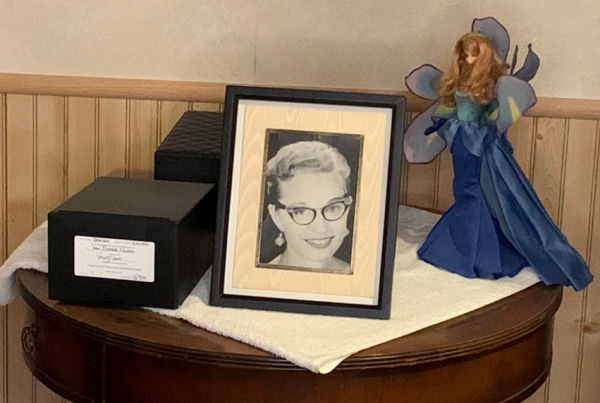 A woman's photo next to her ashes.