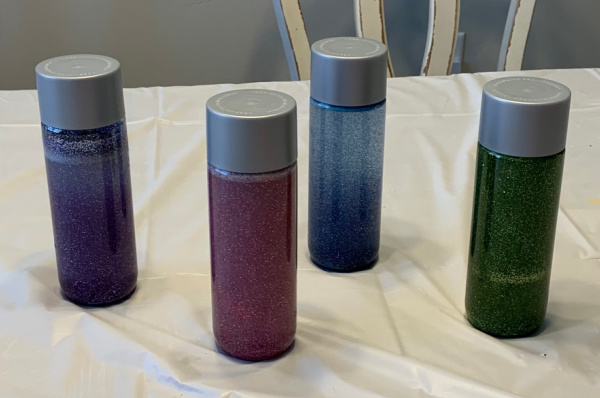 Four glitter stress relief bottles.