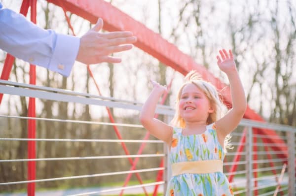 Young firl getting a high five.