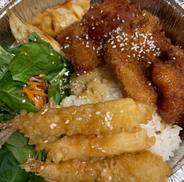 Comfort Bowl combination: shrimp, chicken, salad, and rice.