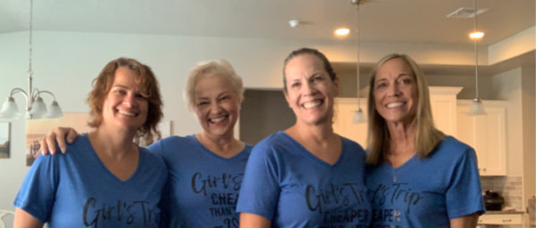 Four sisters in matching shirts.