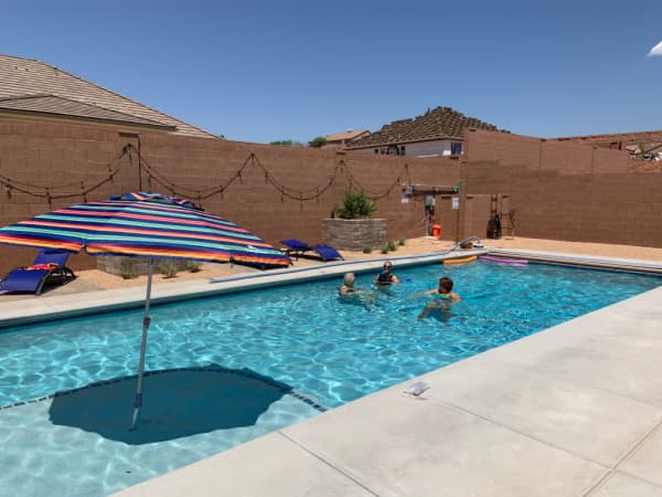 Three ladies in a swimming pool.