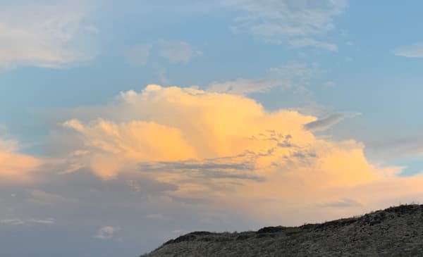 Orange clouds in a blue sky.