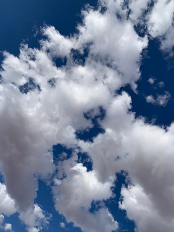 White clouds in a blue sky.