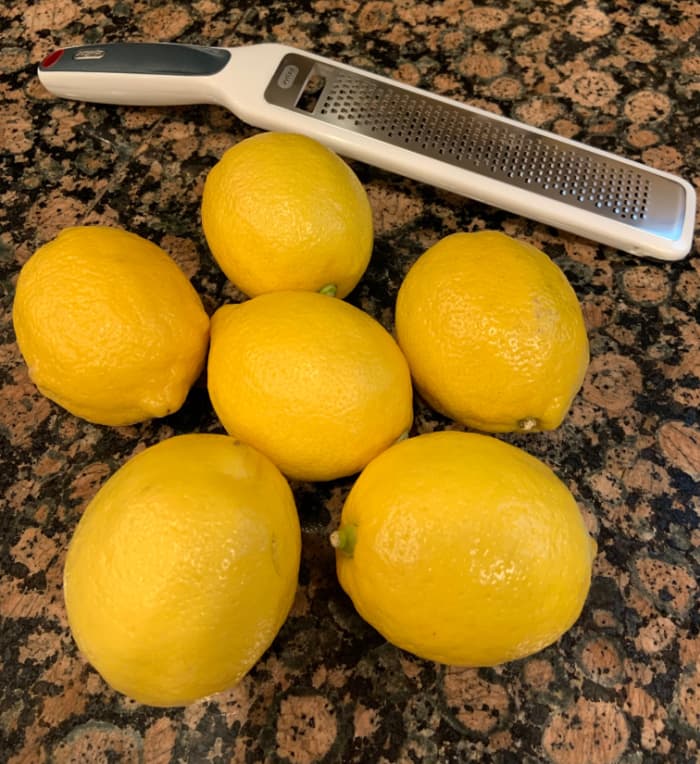 Six lemons and a zester.