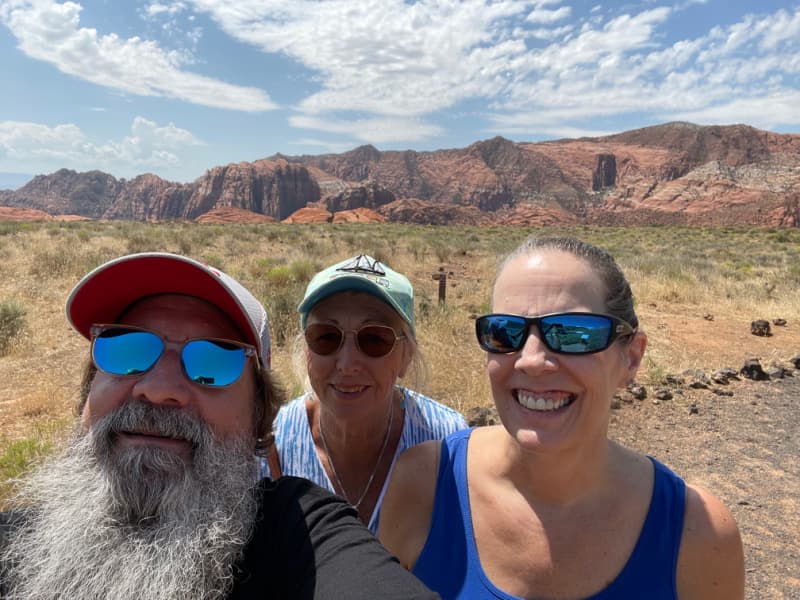 Three people in Snow Canyon in Southern Utah.
