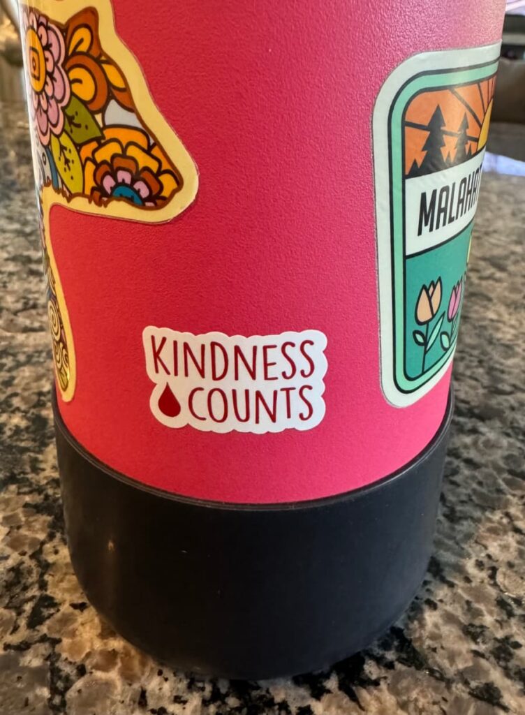 Kindness counts decal on a water bottle.