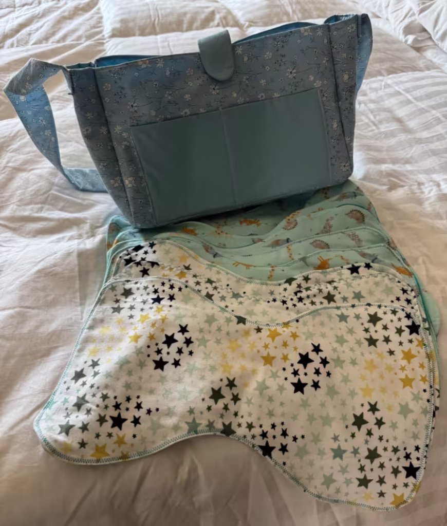 Hand-sewn tote bag and burp rags.