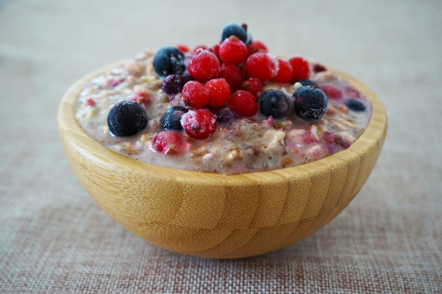 A bowl of overnight oats and berries.