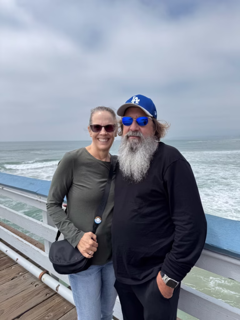 Middle-aged couple on a pier in San Clemente, CA.