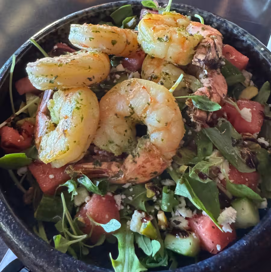 Shrimp salad with arugula and watermelon.