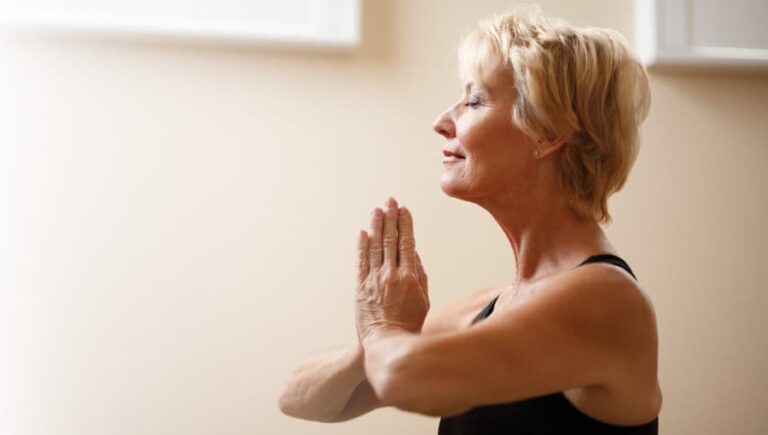 Middle-aged woman doing yoga.
