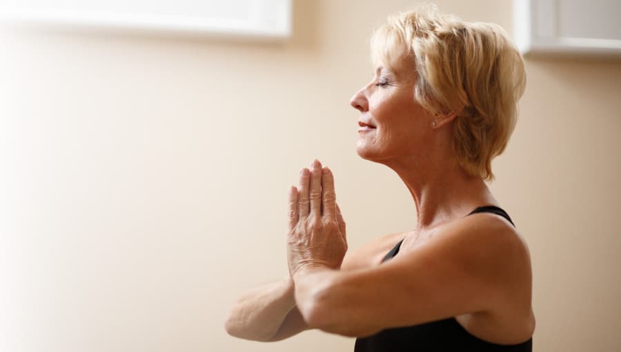 Middle-aged woman doing yoga.