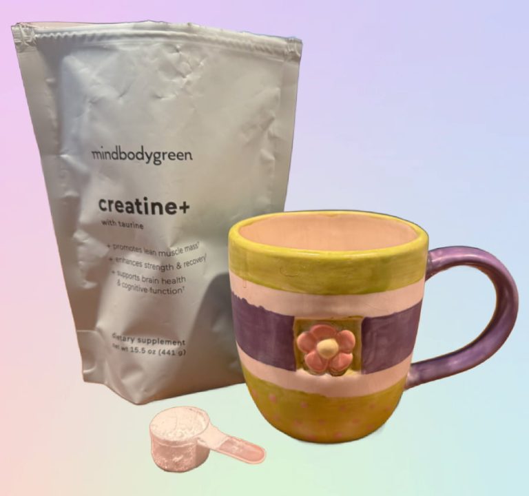 mindbodygreen creatine+, coffee cup, and scoop.