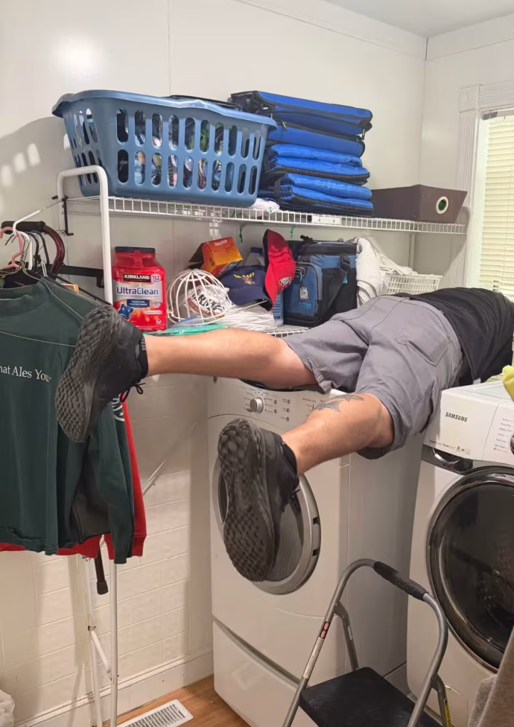 Man installing a dryer.