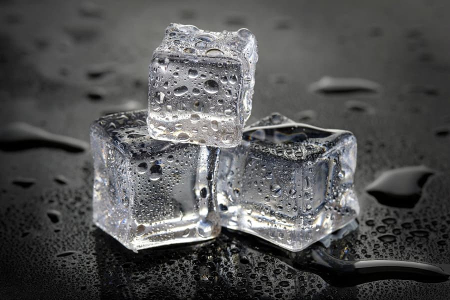 Ice cubes stacked in a pyramid.