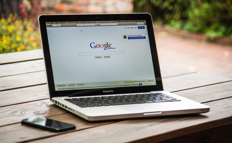 Mac laptop with Google on the screen.