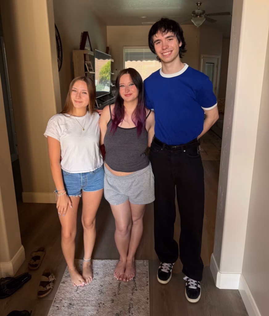 Three young adult siblings.