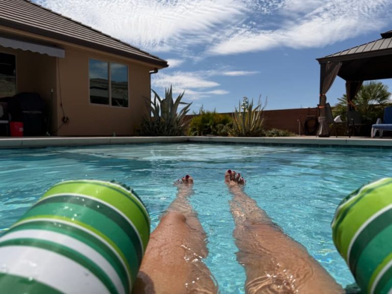 A woman floating in a swimming pool.