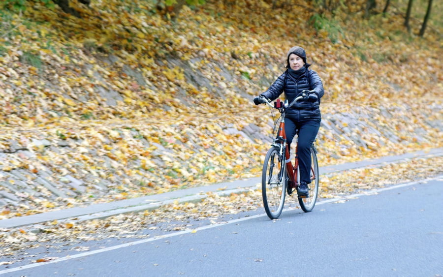 A woman riding a bike.